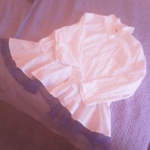 Stark white button down blouse with purple peplum